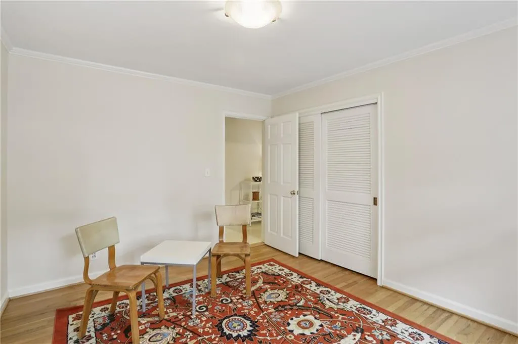Another view of the guest bedroom showing ample closet space.