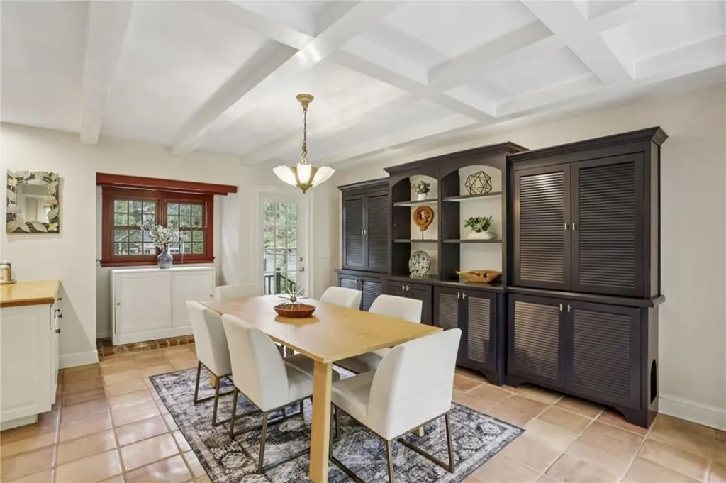 Notice the windows from each end. The beamed ceiling enhances all the natural light. Enjoy access to the beauty of outdoor space