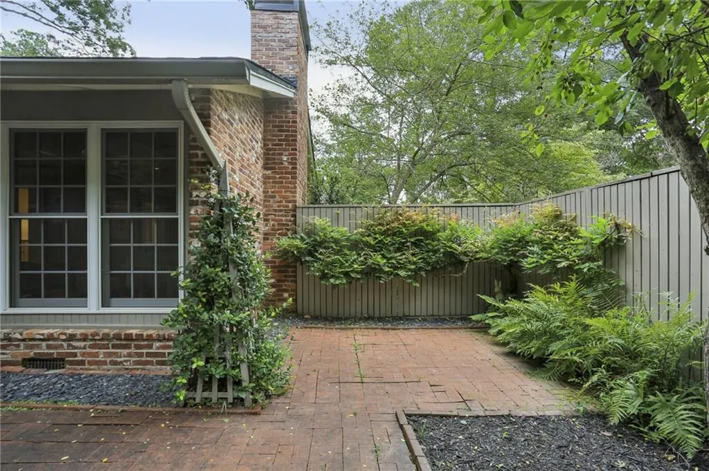 Private patio space is lush with nature. Morning coffee?