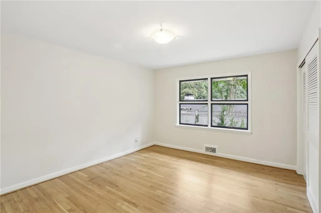 Gleaming natural finish hardwood floors and double windows drawing in the natural light.