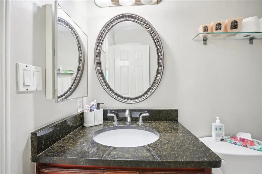 Bathroom featuring toilet and vanity