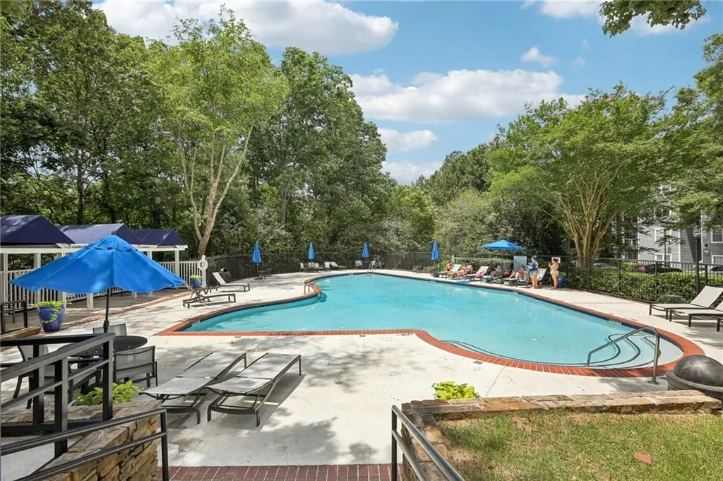View of swimming pool with a patio