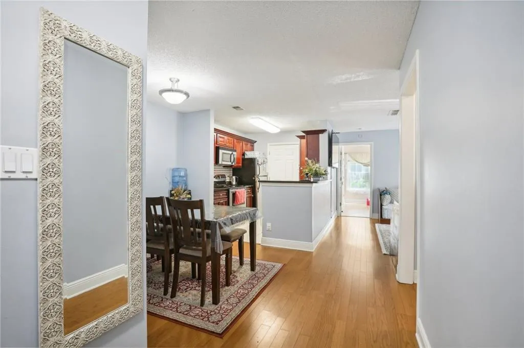 Dining area with hardwood / wood-style floors