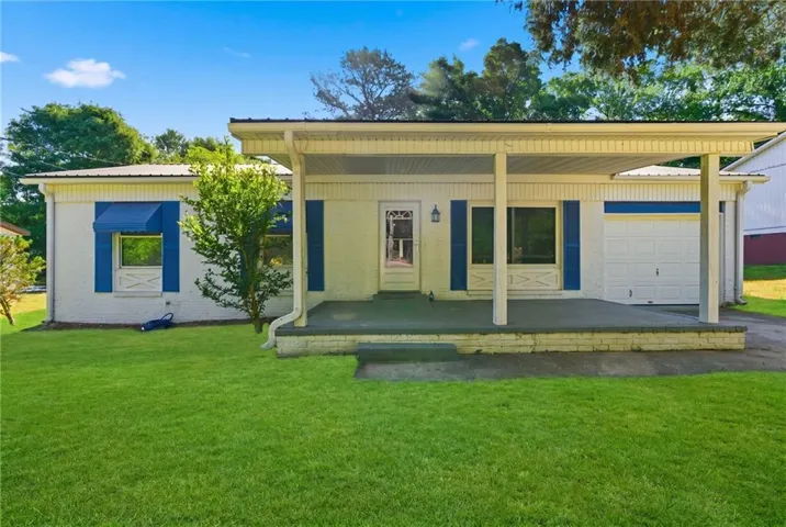 White brick exterior with blue shutters