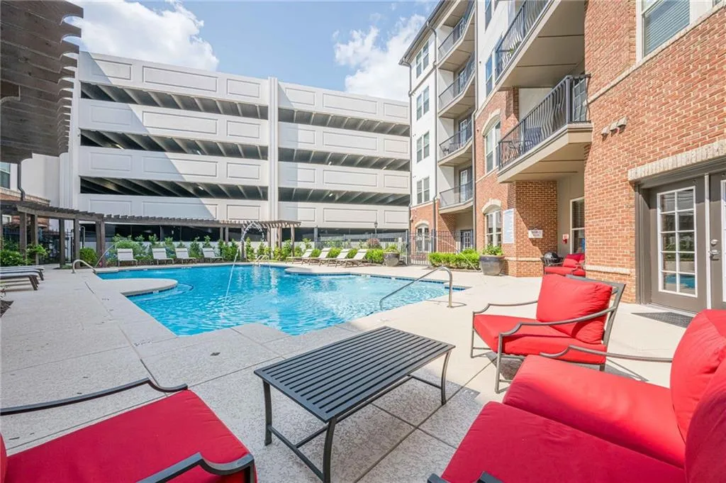 Community pool featuring a patio
