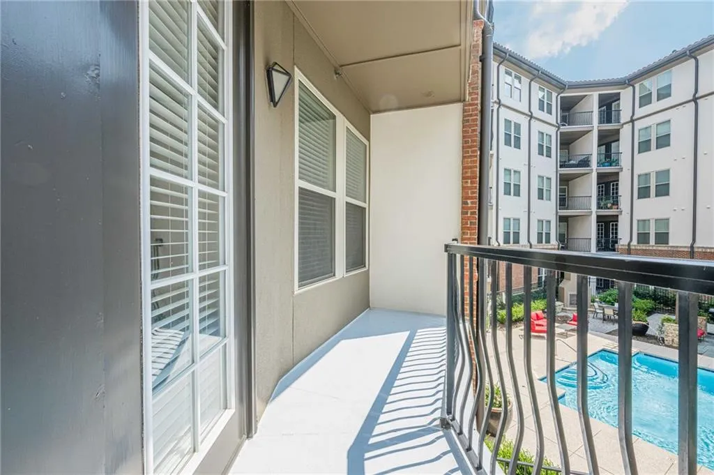 Balcony with view of pool area