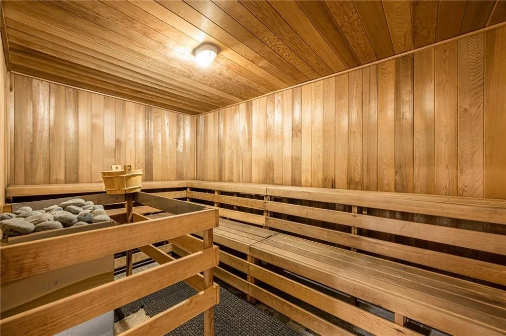 Sauna / steam room featuring wood walls and wood ceiling