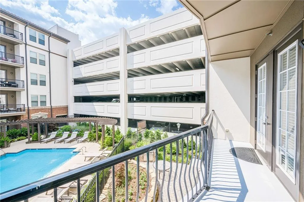 Balcony with view of pool area