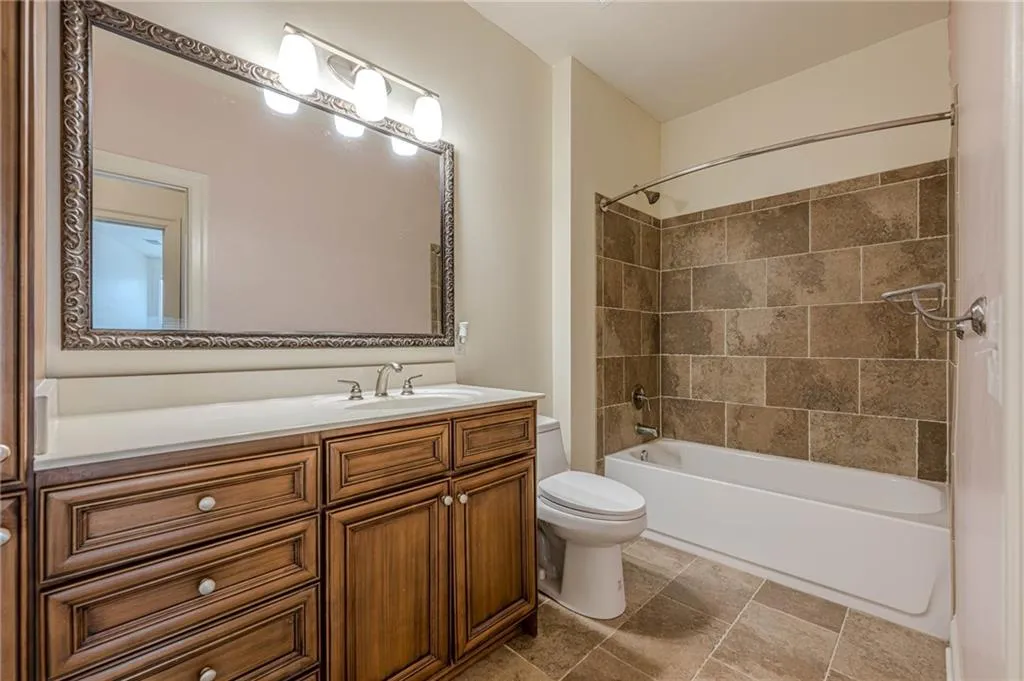 Full bathroom featuring vanity and shower / washtub combination