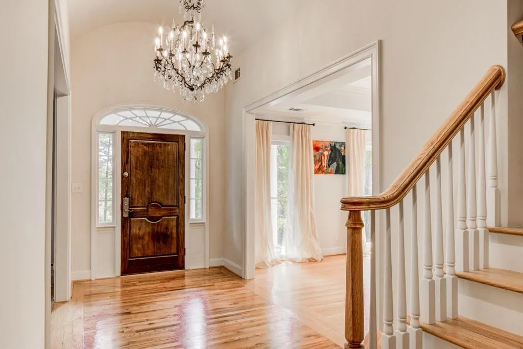 Entry foyer with permanent stairs to unfinished attic
