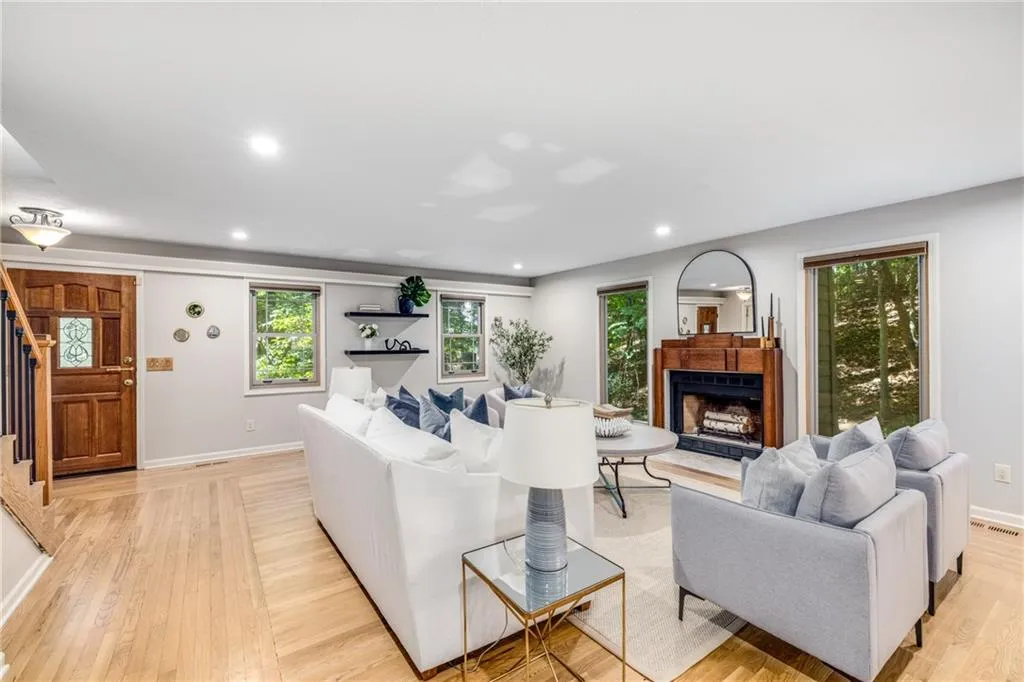 All new dual pane vinyl windows, custom window treatments, recessed lighting, reclaimed fireplace and private surround create the perfect sanctuary to call home.
