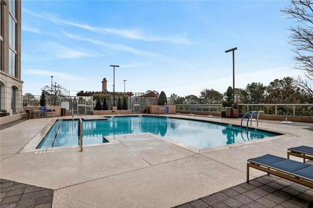 Community pool featuring a patio area