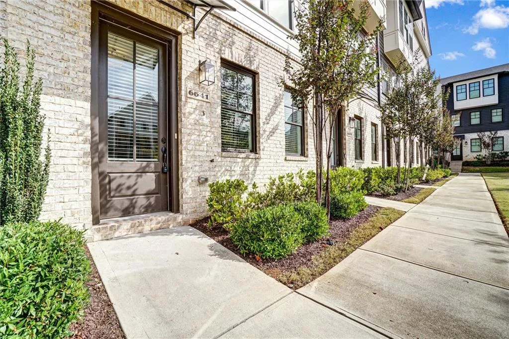 Entrance to property with brick siding