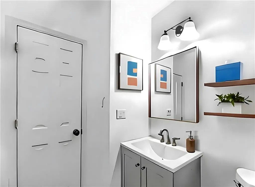 Bathroom featuring vanity and toilet