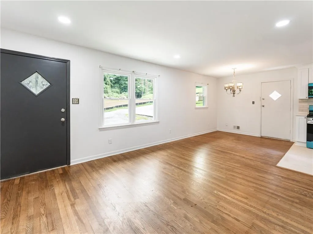 Foyer featuring recessed lighting, light wood-style flooring, and a chandelier