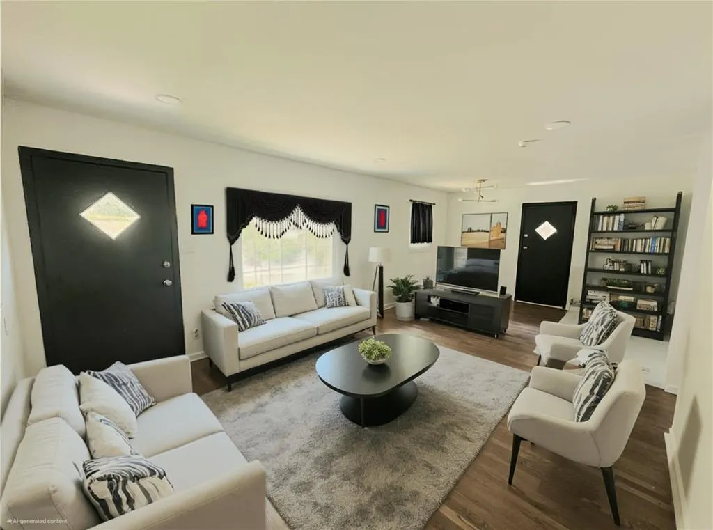 Living area featuring wood finished floors and recessed lighting