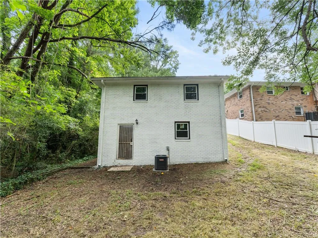 Back of house with brick siding
