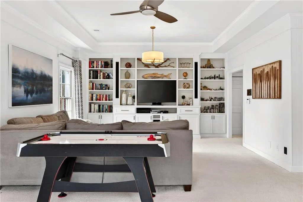 The terrace level offers a versatile space that works beautifully as a playroom, media room, or casual gathering area.