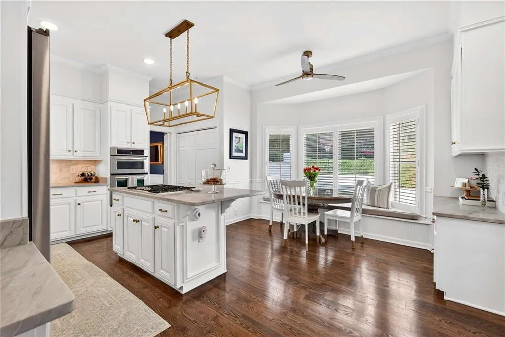 A charming bay window creates the perfect spot for casual breakfast seating filled with natural light.