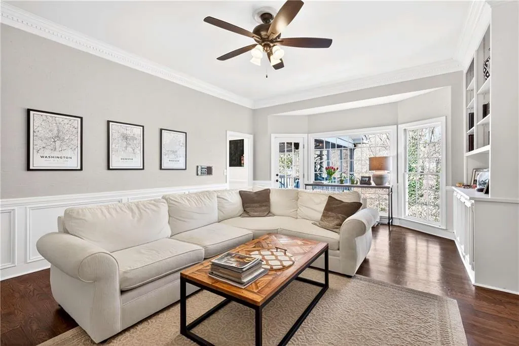 The den is a warm and inviting gathering space, complete with a fireplace that adds charm and comfort.