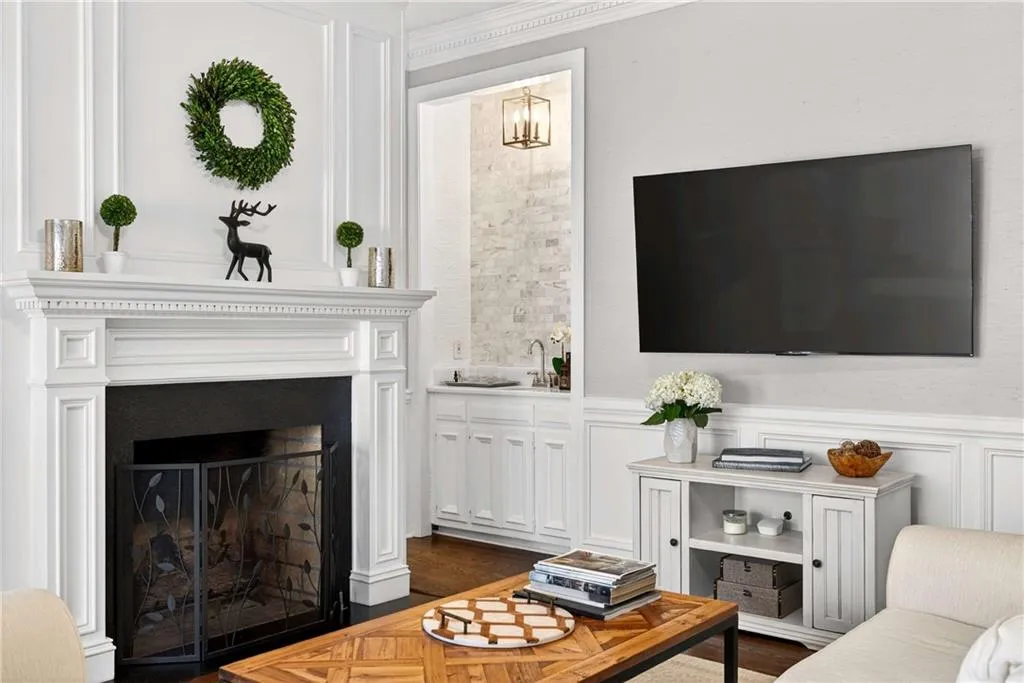 A wet bar adds an extra layer of convenience, making the space ideal for entertaining or relaxing at home.