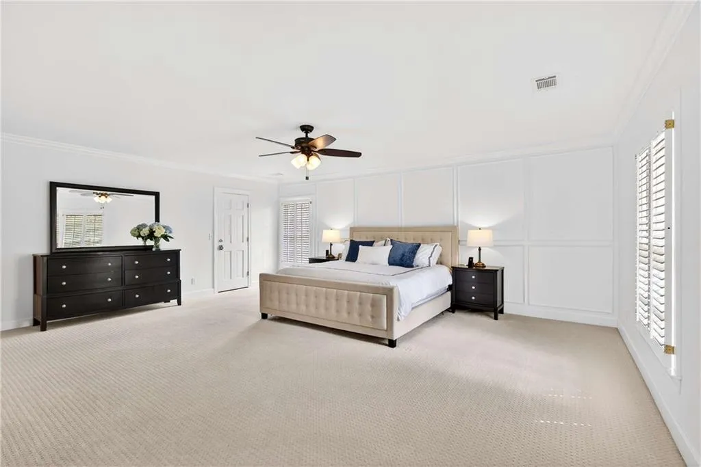 The oversized primary bedroom offers an abundance of space to spread out, unwind, and create a true private retreat.  There is space to enlarge the primary bathroom if desired.