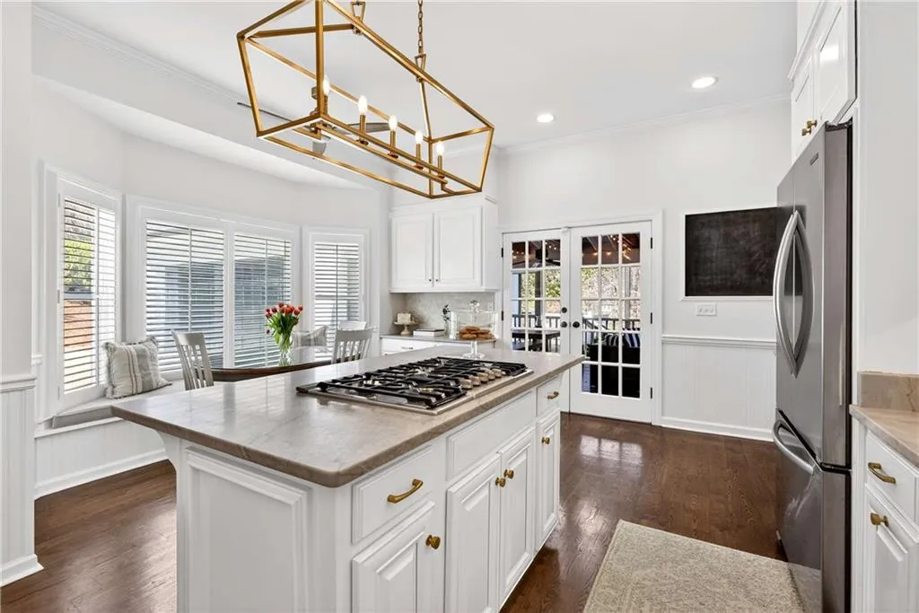 Just off the kitchen, a door leads directly to the screened patio, making indoor-outdoor living and entertaining easy.