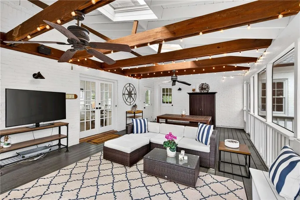 The large screened patio just off the kitchen and den offers a wonderful extension of the living space, ideal for relaxing in comfort while enjoying the sights and sounds of nature.