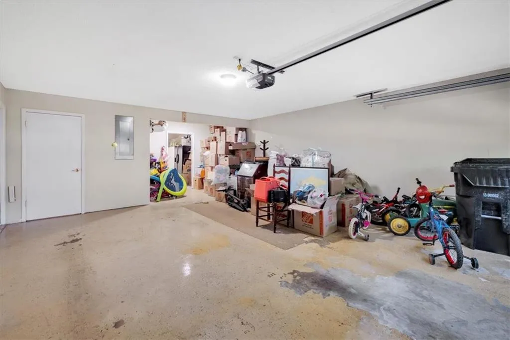 Garage featuring a garage door opener