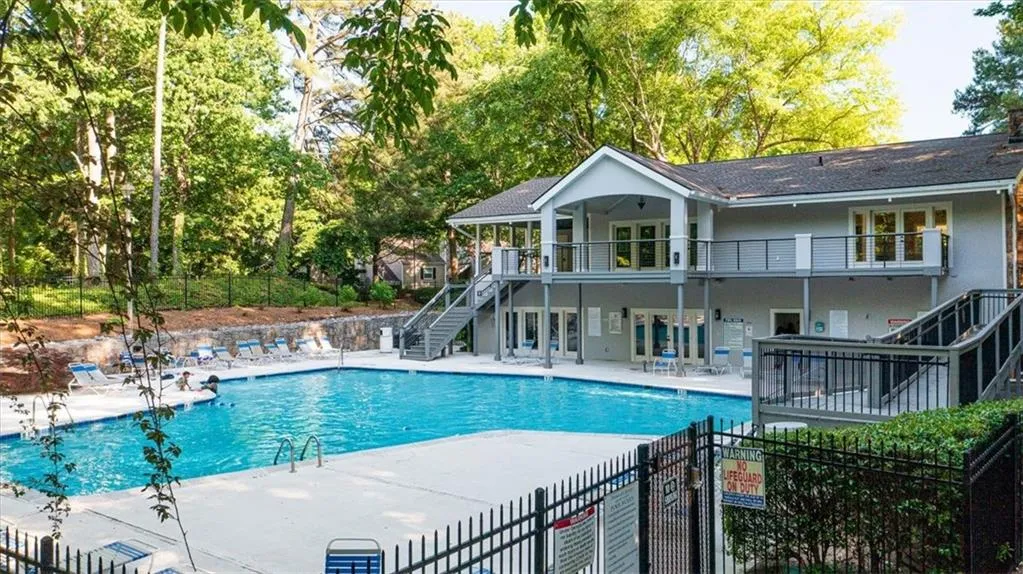View of swimming pool with a patio area