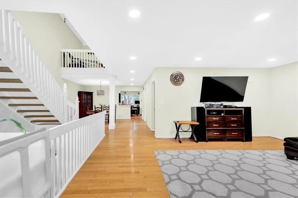 Living room with light wood-type flooring