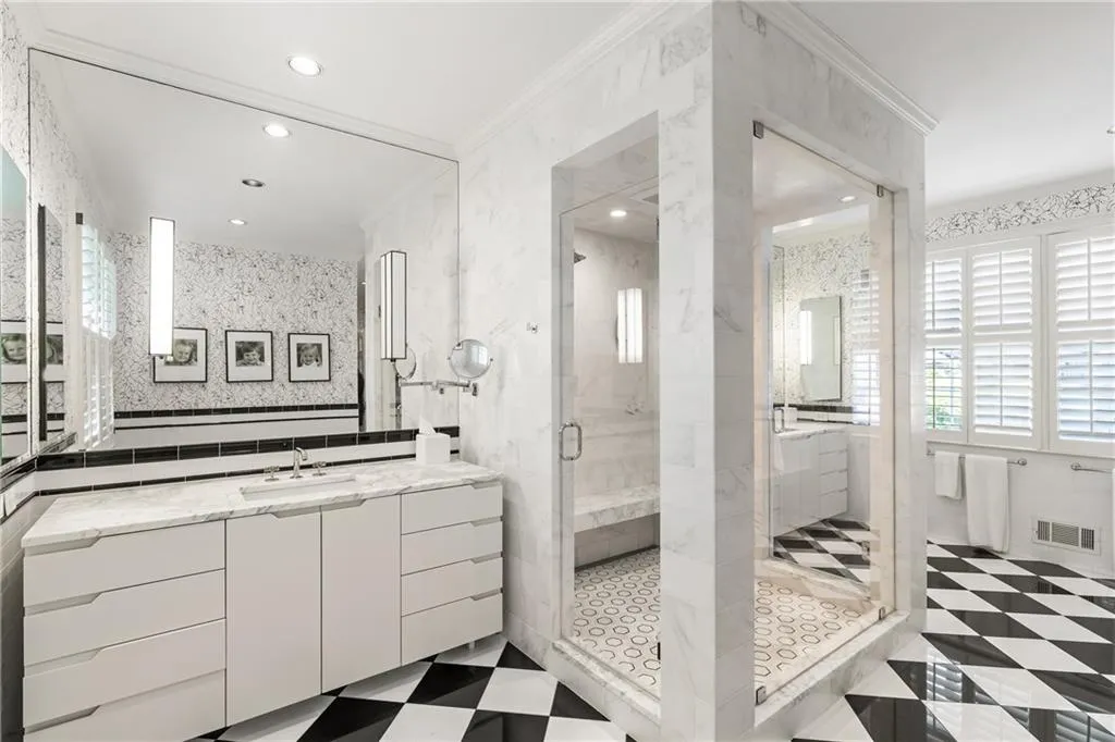 Bathroom featuring a shower stall, ornamental molding, vanity, recessed lighting, and tile walls