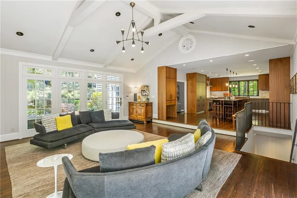 Lobby with beamed ceiling and high vaulted ceiling