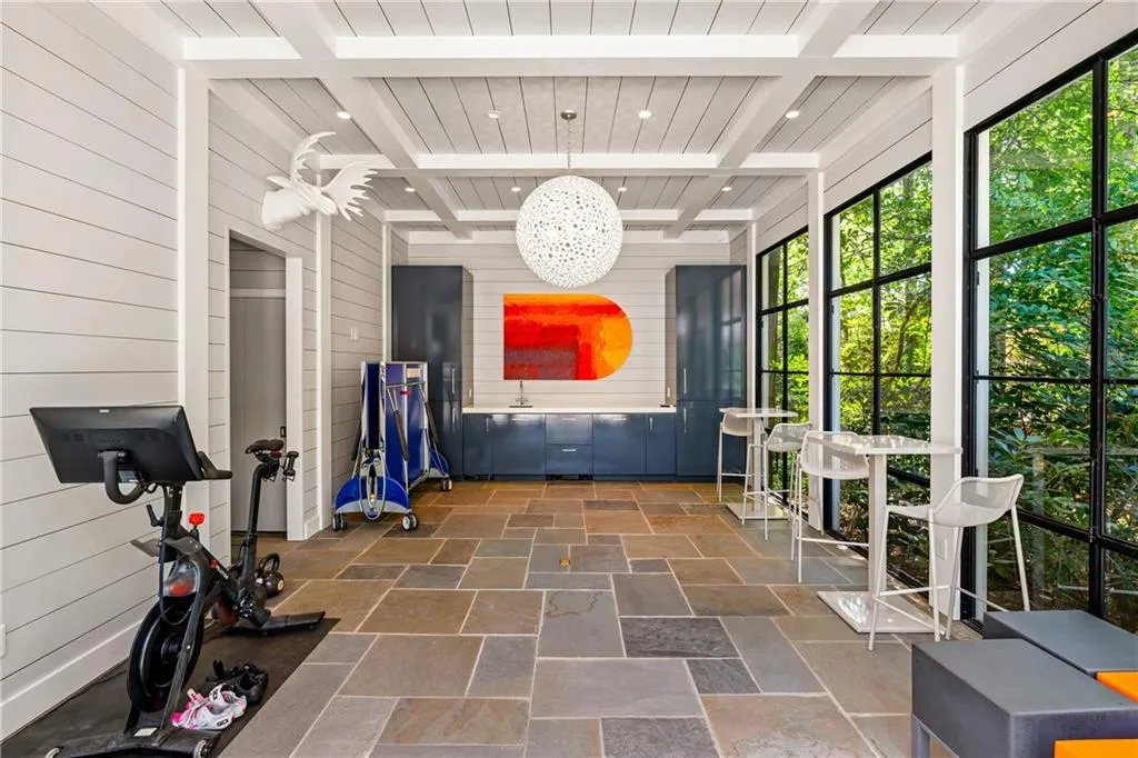 Sunroom with healthy amount of natural light and beamed ceiling