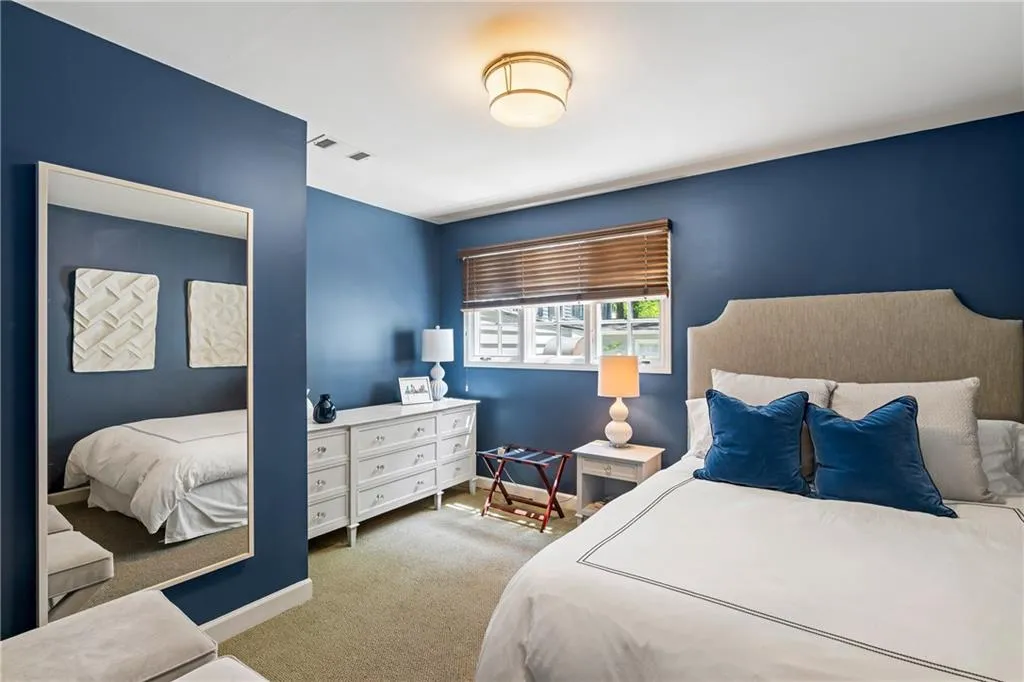 Carpeted bedroom with baseboards