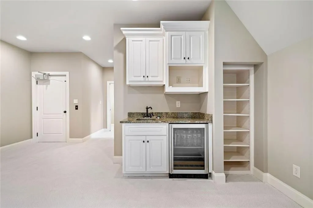 Includes a wet bar, built-in beverage center and space for a microwave