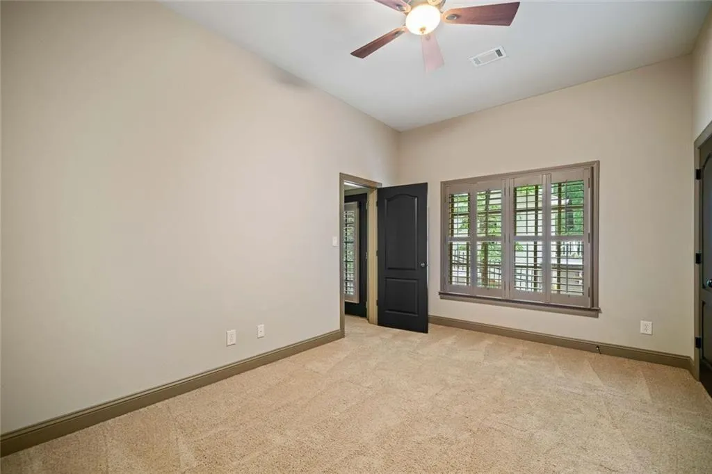 Spacious Bedroom #7 has access to a shared full bath and side exterior entry, making it a perfect guest or in-law suite.