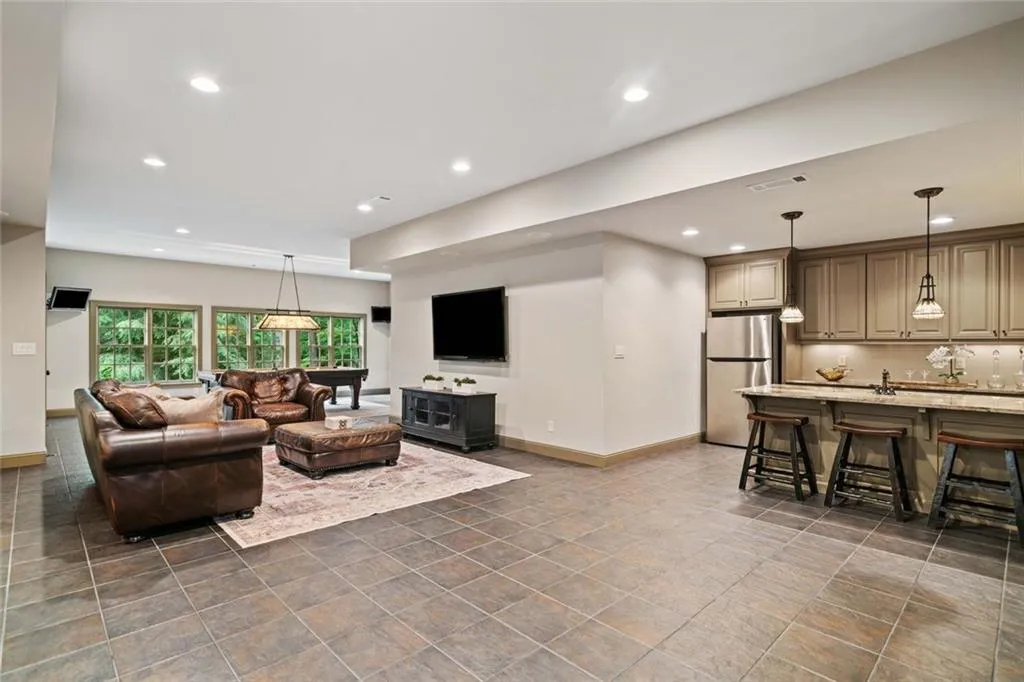 The amazing terrace level offers a complete extension of the home's luxurious living space, designed for entertainment, functionality, and multi-purpose use.