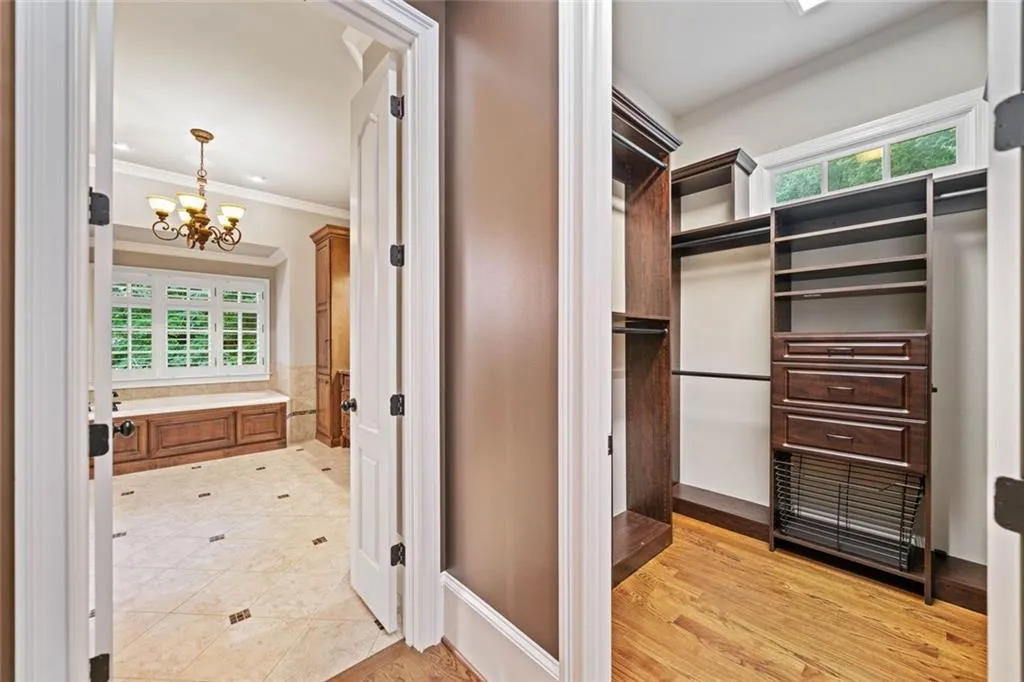 Custom his or her walk-in closet with additional natural light