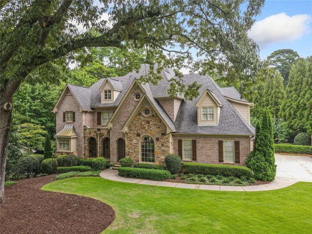 Beautiful, year-round landscaping is enhanced by a 6-zone Rachio controlled irrigation system ensuring lush, vibrant grounds in every season with efficient, low-maintenance care.