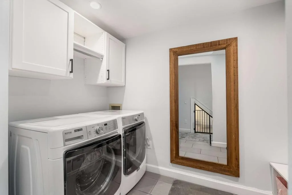 Laundry room located on the lower level off of the studio apartment.