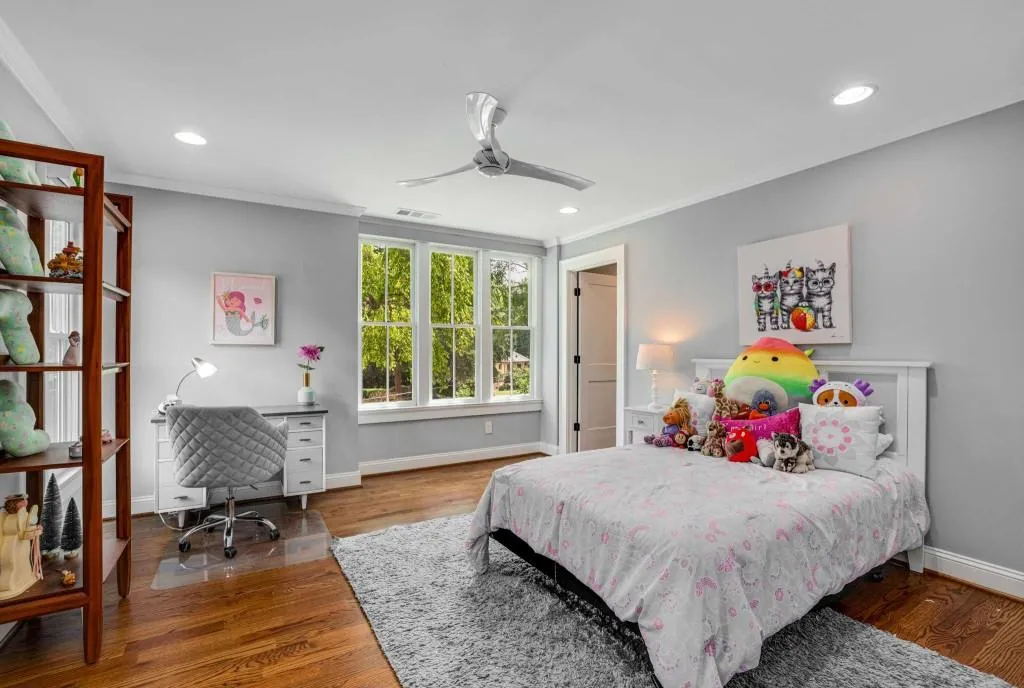 This bedroom with ensuite bath is located on the upper level with Primary and one additional bedroom