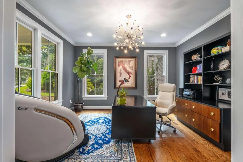 The home office is located in the front of the home overlooking the amazing front lush lawn.