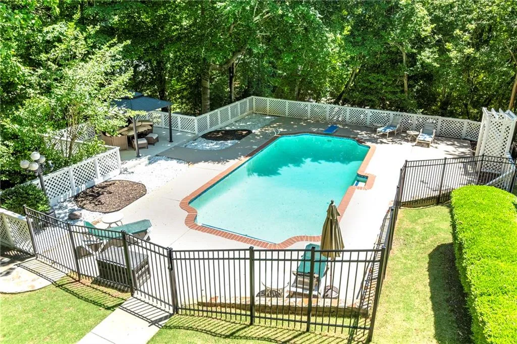 View of swimming pool with a patio
