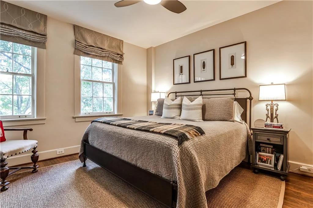 Bedroom with wood finished floors and a ceiling fan
