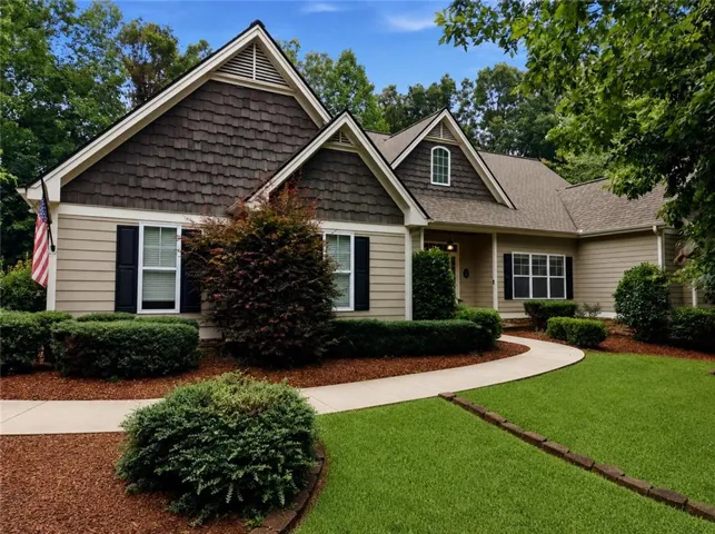 Craftsman-style exterior with wood shake siding accents and light-colored horizontal siding