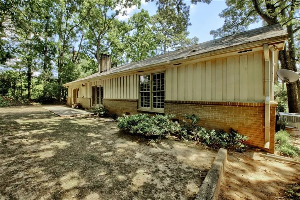 View of side of property with a patio