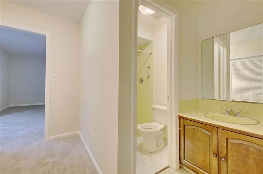Bathroom with a shower, toilet, and vanity