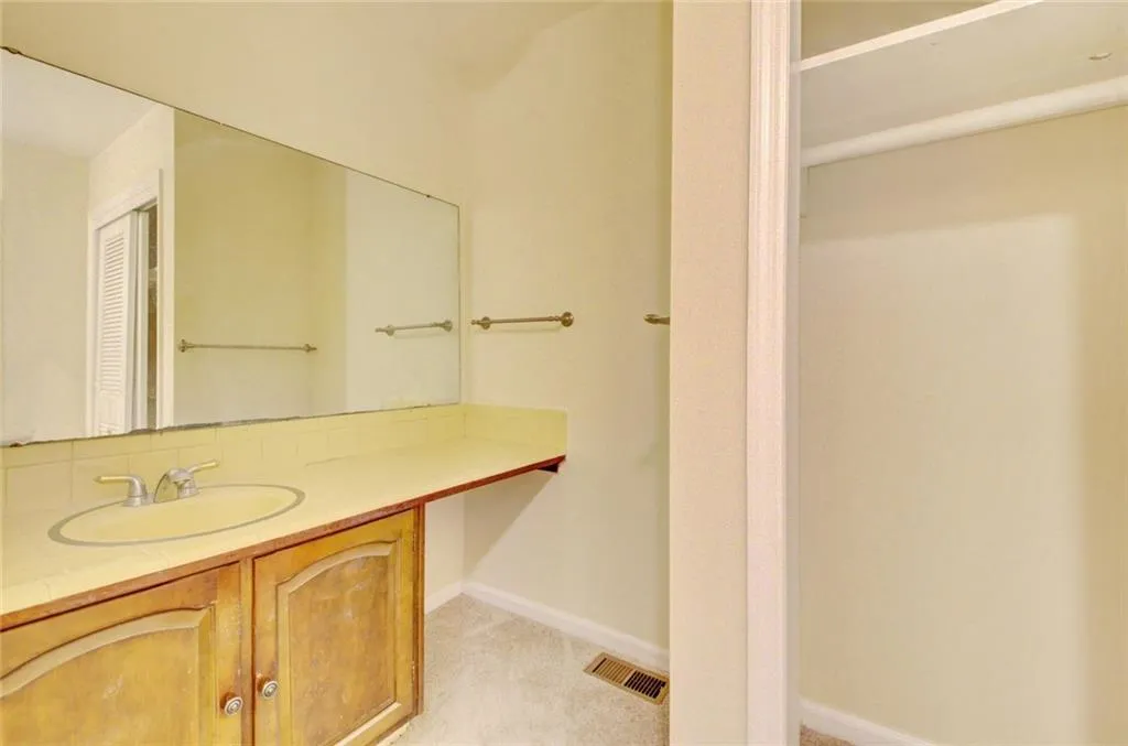 Bathroom with a shower, toilet, and vanity