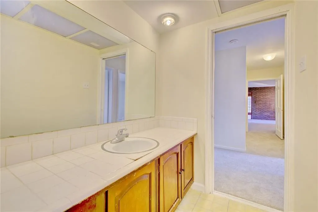 Bathroom featuring tile patterned floors and vanity